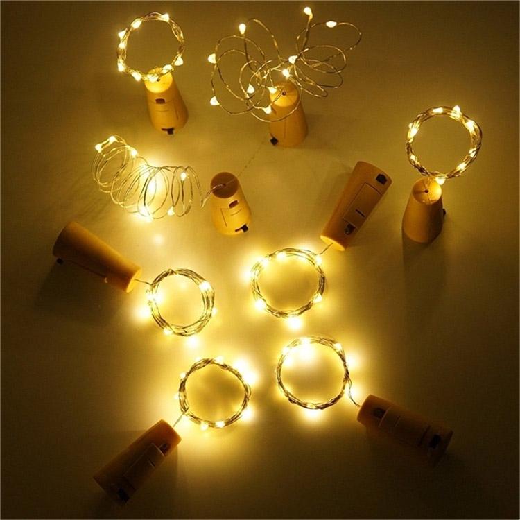 Bouchon de bouteille avec guirlande à leds - 20 leds - l=2m, blanc chaud, à piles (3xlr44) - lot de 10